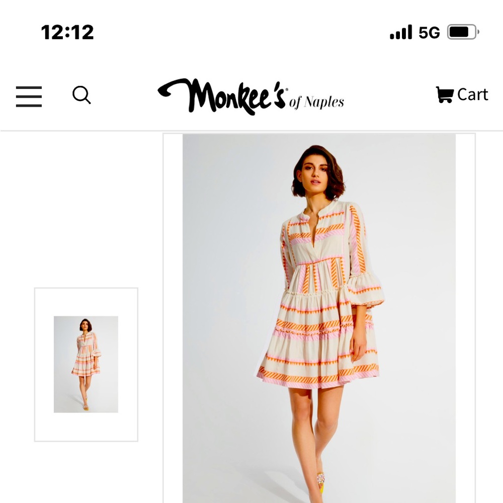 the Ella style white lotus dress in Ivory with pink and orange detail